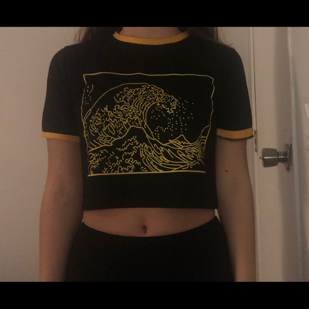 2 black crop tops with designs